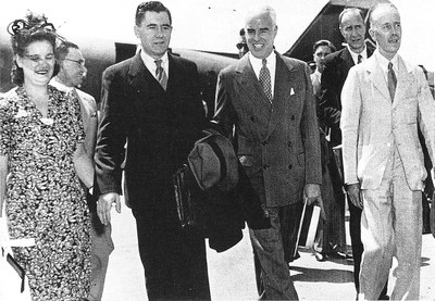 Andrei A. Gromyko, Soviet ambassador to the United States, and his wife are welcomed upon their arrival in Washington by the chairmen of the American and British delegations