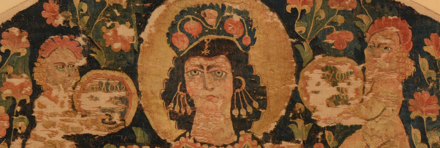 A tapestry featuring a richly adorned woman wearing pearl earrings, a bejeweled collar, and golden bracelets sits atop a gemstone-studded throne.