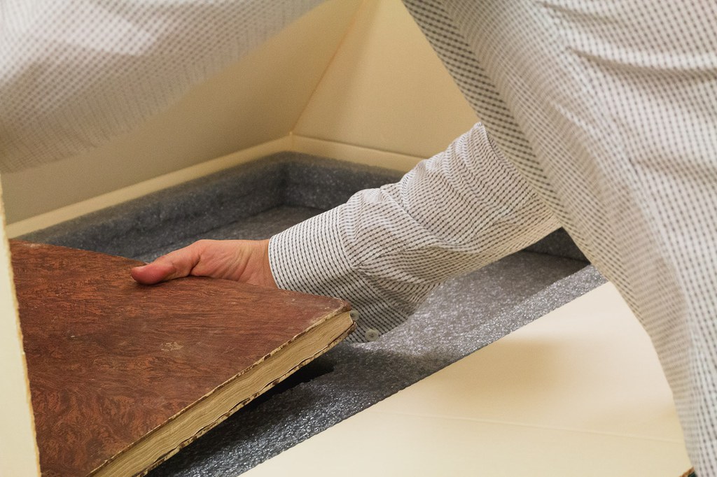 Curator of rare books Anatole Tchikine builds a custom foam bed for two volumes of Delle delicie del fiume Brenta