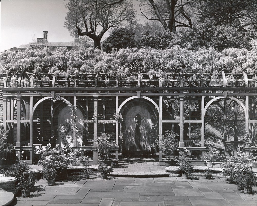 Figure 2. The Arbor, perhaps in the 1950s. The lead bookcase, inscription, and lotus flowers are now visible in the arch on the left