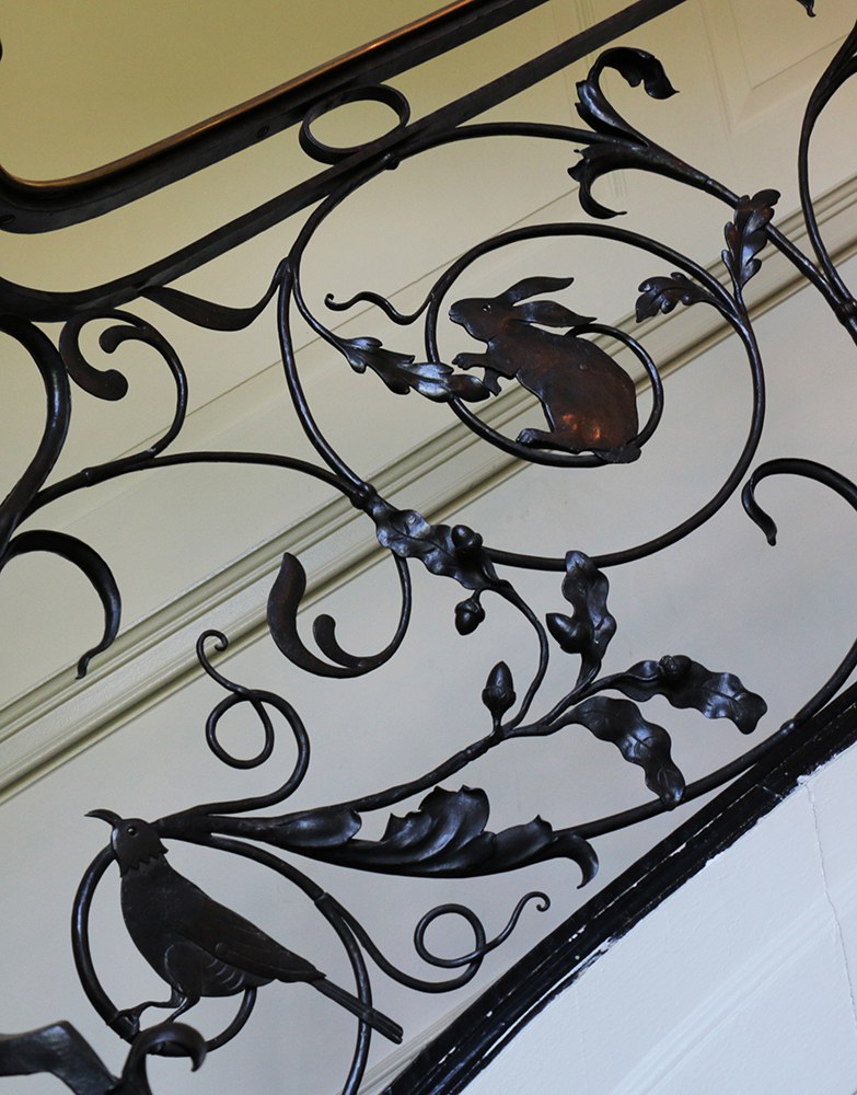 Figure 11. Detail of a banister in the Main House, leading to the second floor, with oak leaves and acorns incorporated into the design.
