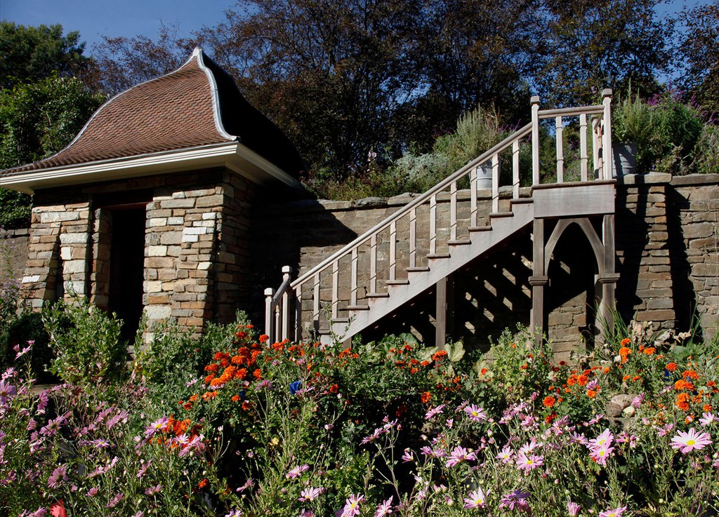 Wooden staircase from Kitchen Gardens to Box Walk, with toolshed to the left