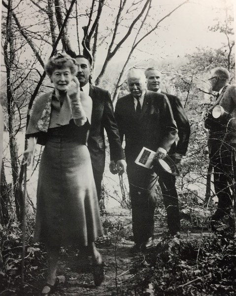 Black-and-white photograph of Mildred Bliss leading five members of the Garden Advisory Committee through the Dumbarton Oaks Gardens