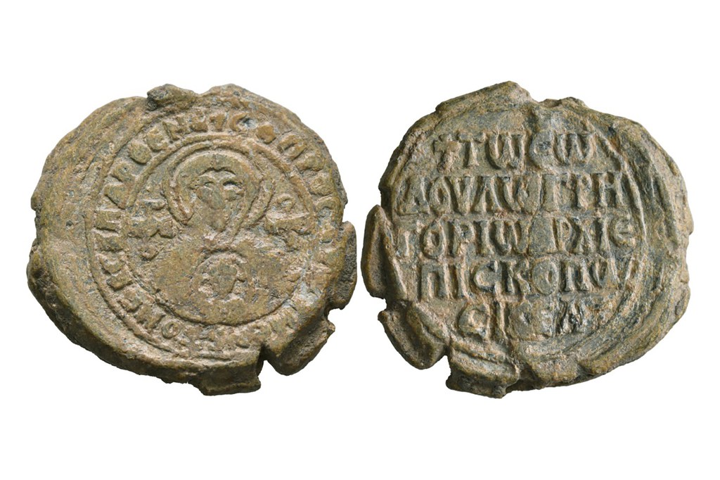 Obverse and reverse of lead seal of Gregory Asbestas, archbishop of Sicily, depicting Virgin holding Child.