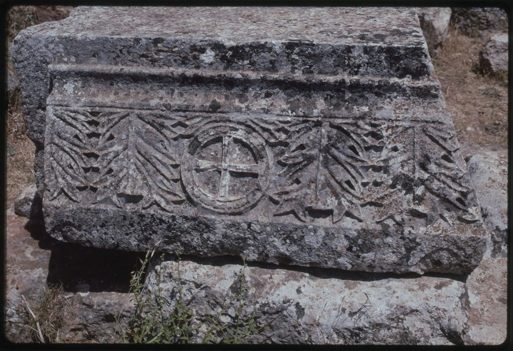 A lintel with cross outside the church at Qirq Bizeh.