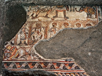 Fig. 3: Mosaic with a battle scene (?) with elephants and male figures framed by an arcade.