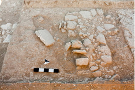 Fig. 7: View of partially excavated grave cut, which postdates the line of W4003 (photo 0467, B. Miller, University of Canberra).