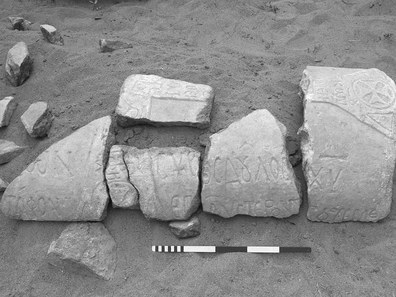 Fig. 5: Fragments of an inscribed marble sarcophagus lid (T2031), found in a garden wall belonging to Şerafettin Arıözsoy.