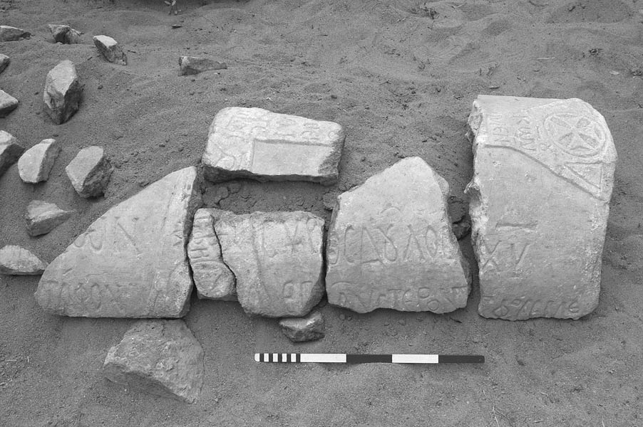 Fig. 5: Fragments of an inscribed marble sarcophagus lid (T2031), found in a garden wall belonging to Şerafettin Arıözsoy (Lightfoot 2006–2007)