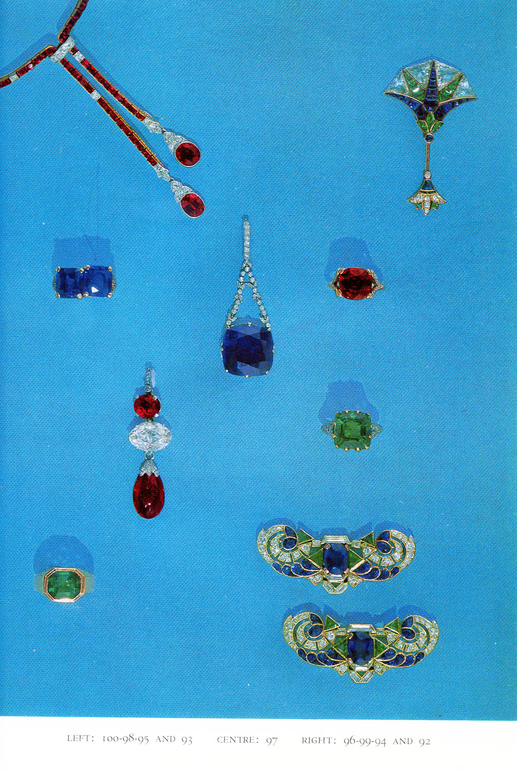 Jewelry, Including 24.9 carat sapphire and diamond pendant (97, center), 9 carat emerald and diamond ring (94, right, lower middle), and diamond and sapphire brooches (92, lower right).
