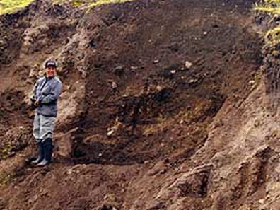 Fig. 5: West side of Cerro Narrío showing scar where backhoe removed earth.