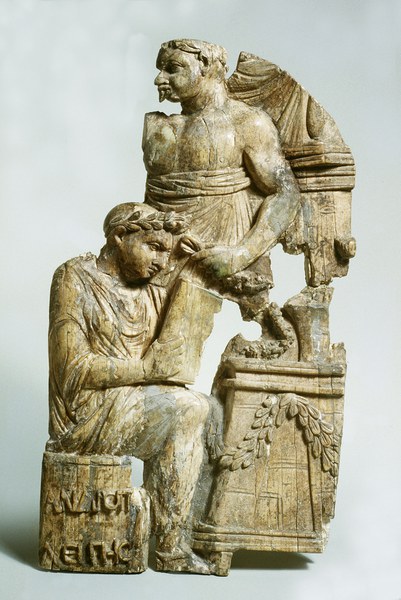 Stone relief carving depicting two individuals