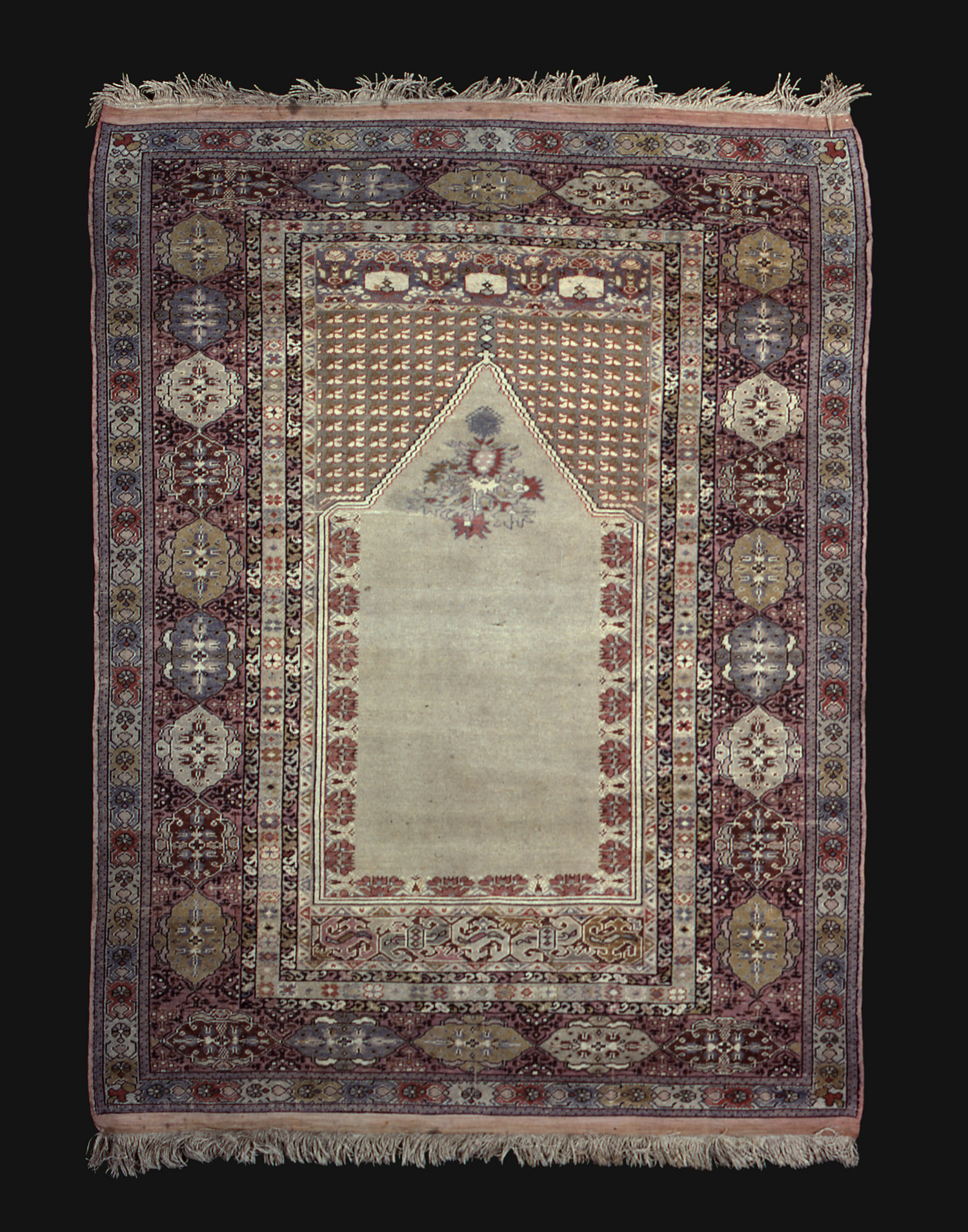 Reproduction of a Gördes prayer rug. Photograph courtesy of the Textile Museum and the George Washington University Museum.