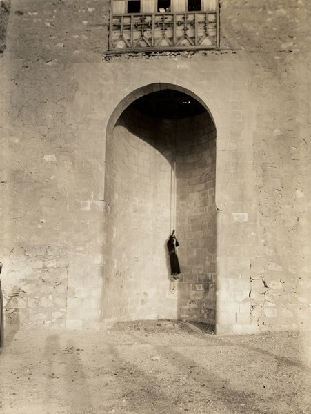 Old entrance; monk hoisted by rope lift into upper level entrance