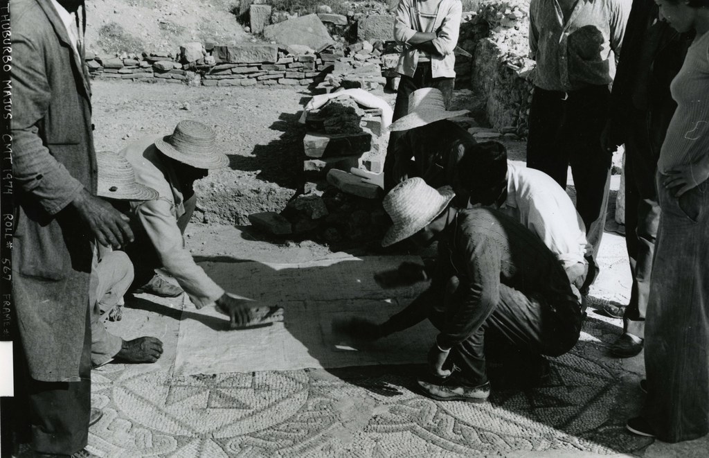 CMT team and Tunisian workers clearing a mosaic pavement at Thuburbo Majus