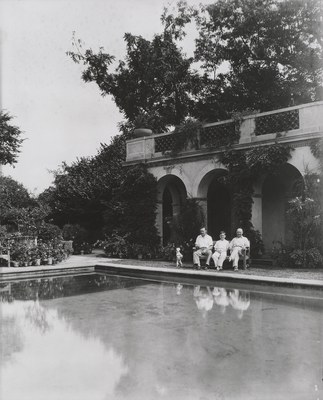 Men and dog sitting by the Swimming Pool, 1930–1935