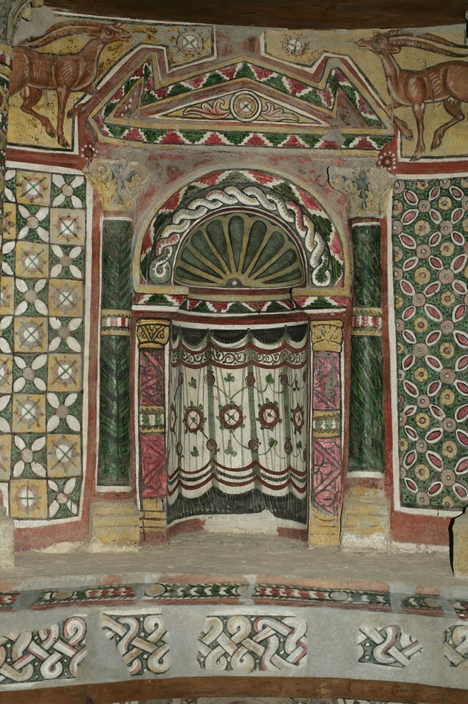 Painted niche with curtains