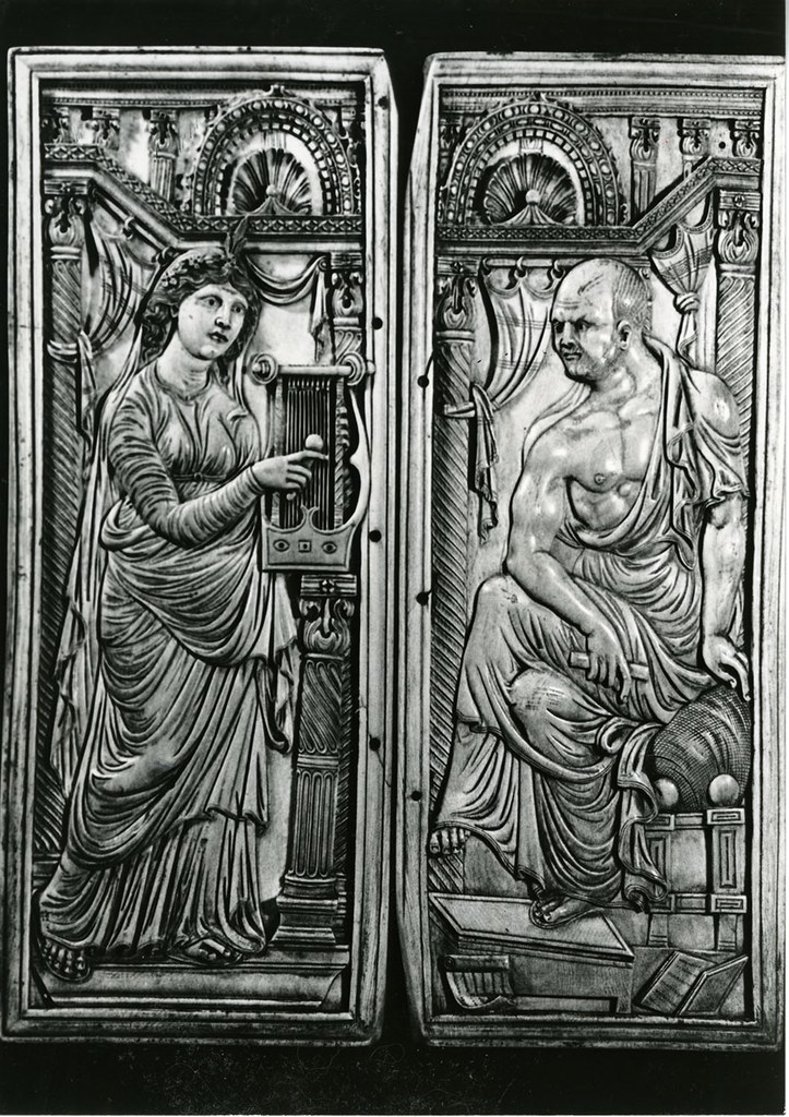Ivory diptych of poet and muse in a curtained space