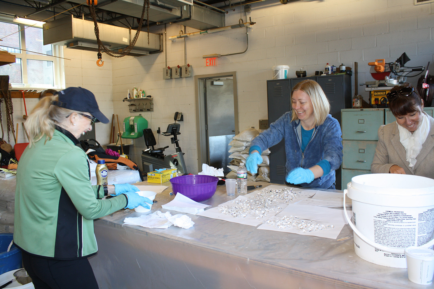volunteers cleaning the crystals for shipment, Oct. 2013