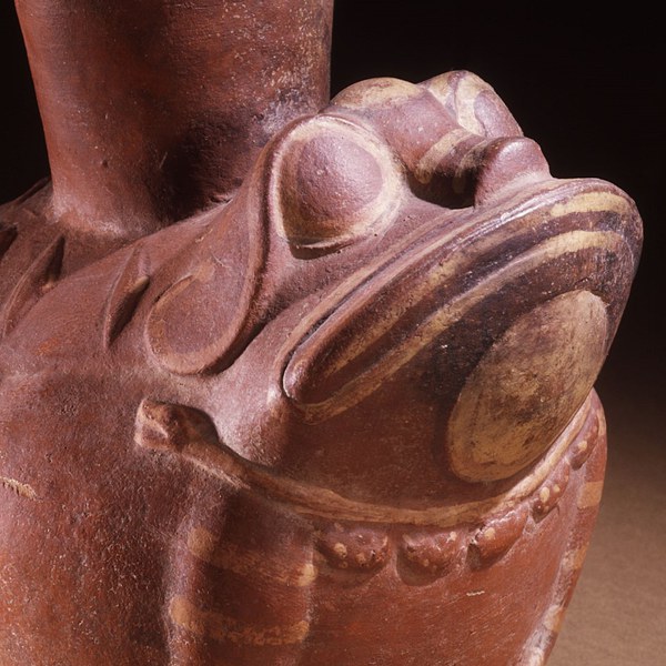 Reddish-brown jar in the shape of a stylized frog